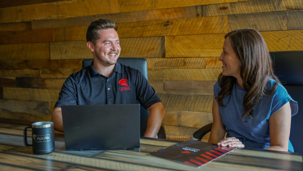Health insurance broker helping a client compare coverage options