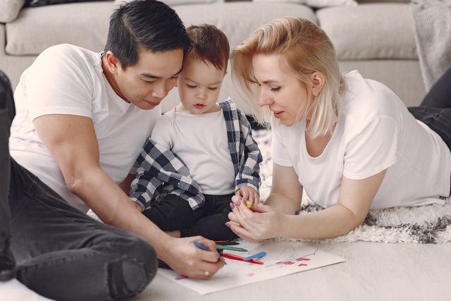 Parent writing a list of family doctors and prescriptions before comparing health insurance plans
