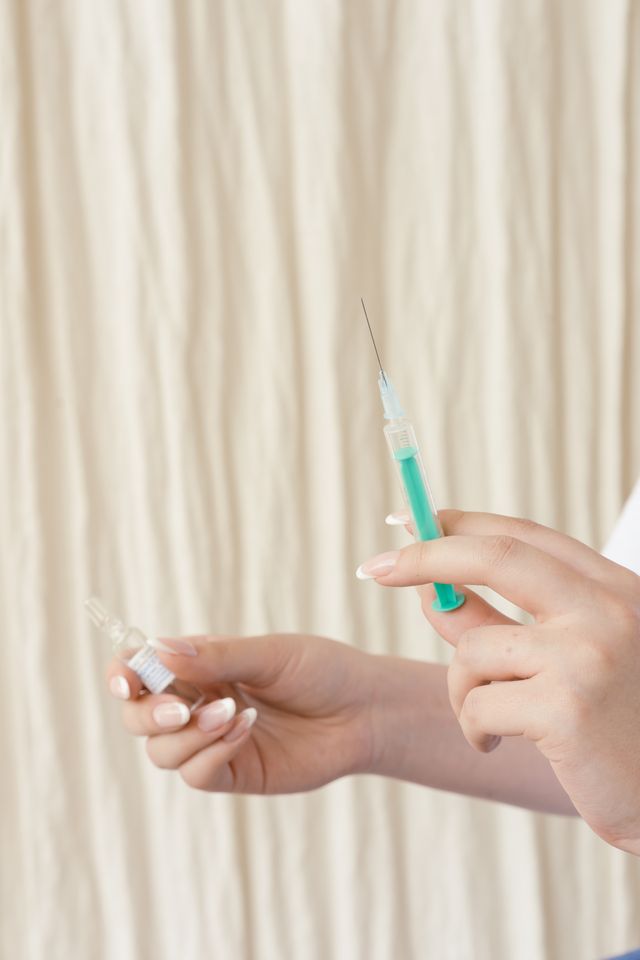 Person discussing GLP-1 weight loss medication coverage with a doctor